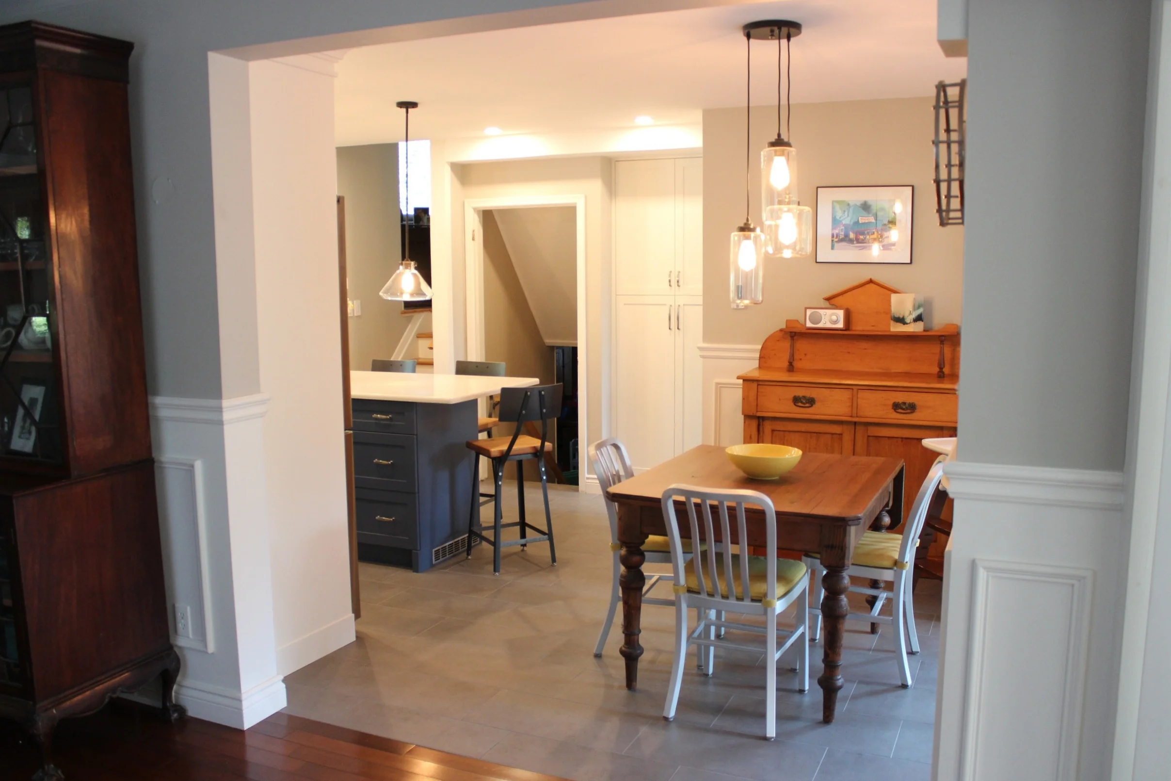 Looking into the kitchen space, you can see the pairing of old antiques, with a brand new kitchen. They look great together!