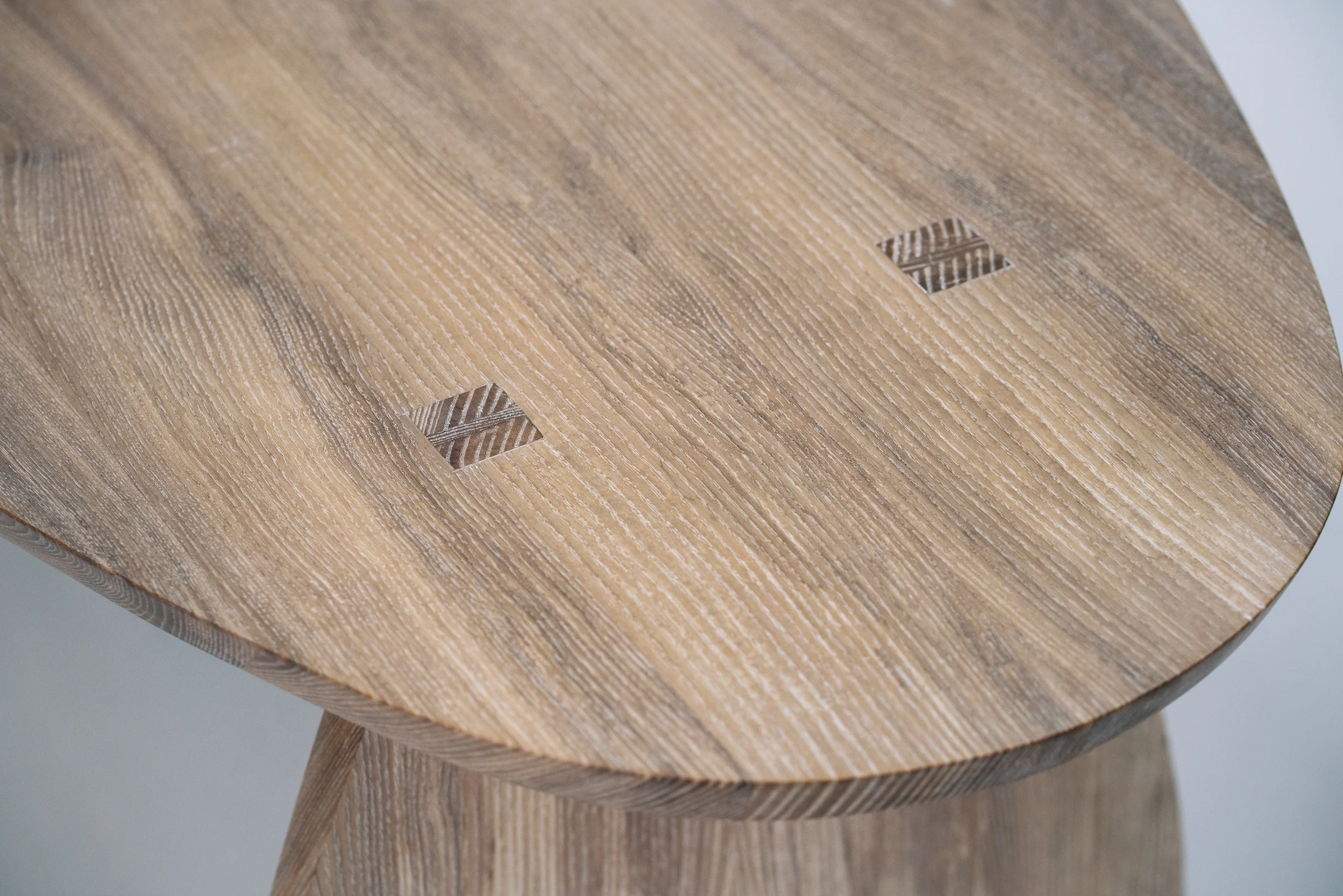 Through and wedged tenons that join the back leg to the top. 