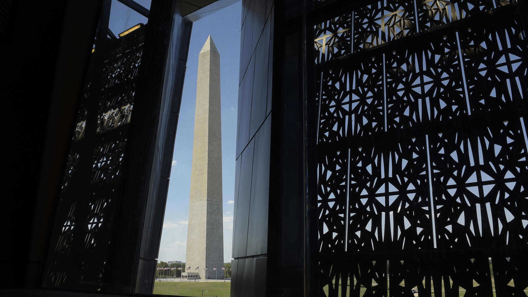 A VIEW OF THE WASHINGTON MONUMENT. Through a "lens" in the architectural facade, visitors can see the Washington Monument on the Mall, and Arlington National Cemetery. Photo credit: Susan Walsh / Associated Press