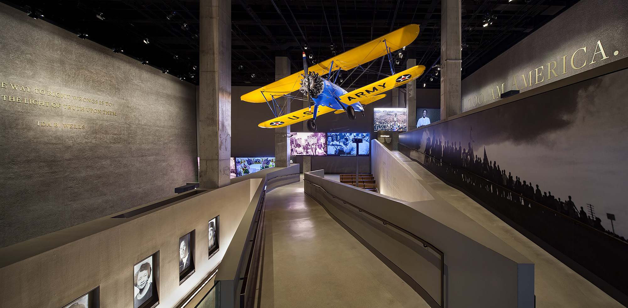 VIEW OF THE TUSKEGEE AIRPLANE, LANDING THEATERS, AND RAMPS FROM THE ERA OF SEGREGATION GALLERY. Photo credit: Ron Blunt
