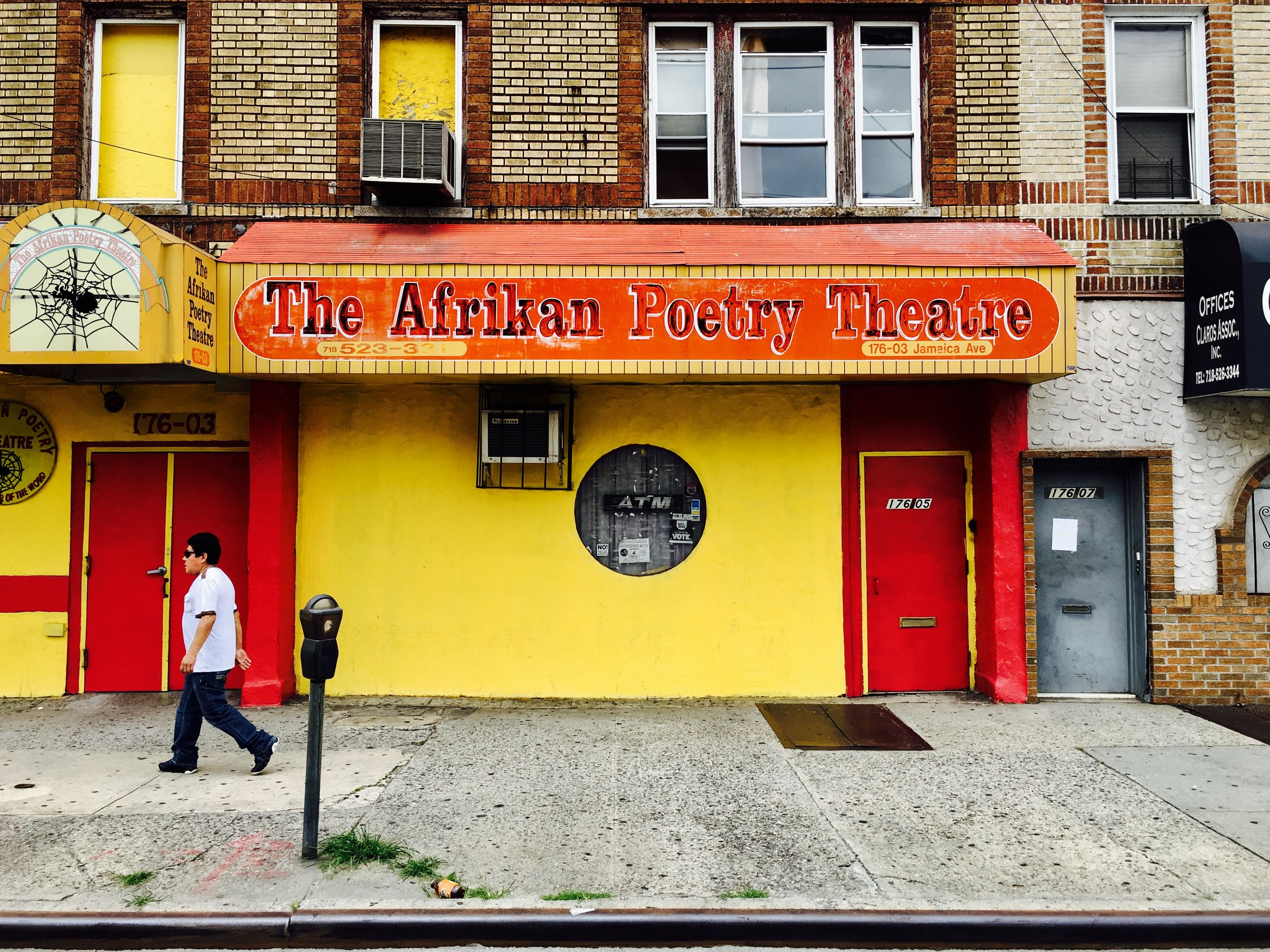 Established in 1976 by co-founders John Watusi Branch and Yusef Waliyaya, the theatre has been stationed at its current location, 176th Street & Jamaica Avenue, since 1979. Yusef Waliyaya and the late John Watusi Branch, in 1976 as a collection of poets, singers and musicians focused on jazz, funk, African rhythms and poetry. The Afrikan Poetry Theatre was incorporated in 1977 and found a home on Merrick Boulevard the following year. It moved to its current location, at 176-03 Jamaica Ave., in 1979. .On November 5, 2006, the theatre celebrated its thirtieth anniversary, where Queens Borough President, Helen Marshall declared the day “Afrikan Poetry Theatre” day. On June 25 of 2016, the intersection of Jamaica Avenue and 176th Street in Jamaica, Queens was named John Watusi Branch Way. Words via Wikipedia photo by Adolfo Steve Vazquez