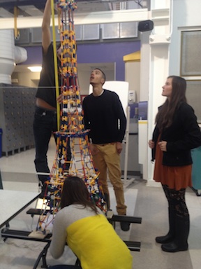 Measuring the structure's height. 