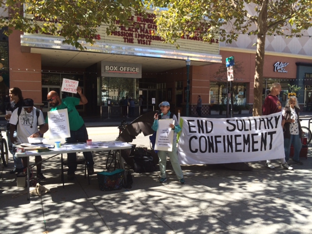 Santa Cruz-Statewide Coordinated Actions To End Solitary Confinement - Readers’ Theater: Statement of plaintiffs on settlement of Ashker v. Governor of California (August 31, 2015) . Photo credit: Alina Hammer.
Normal
0
false
false
false
EN-US
X-NONE
X-NONE
/* Style Definitions */
table.MsoNormalTable
{mso-style-name:"Table Normal";
mso-tstyle-rowband-size:0;
mso-tstyle-colband-size:0;
mso-style-noshow:yes;
mso-style-priority:99;
mso-style-parent:"";
mso-padding-alt:0in 5.4pt 0in 5.4pt;
mso-para-margin:0in;
mso-para-margin-bottom:.0001pt;
mso-pagination:widow-orphan;
font-size:10.0pt;
font-family:"Times New Roman",serif;}