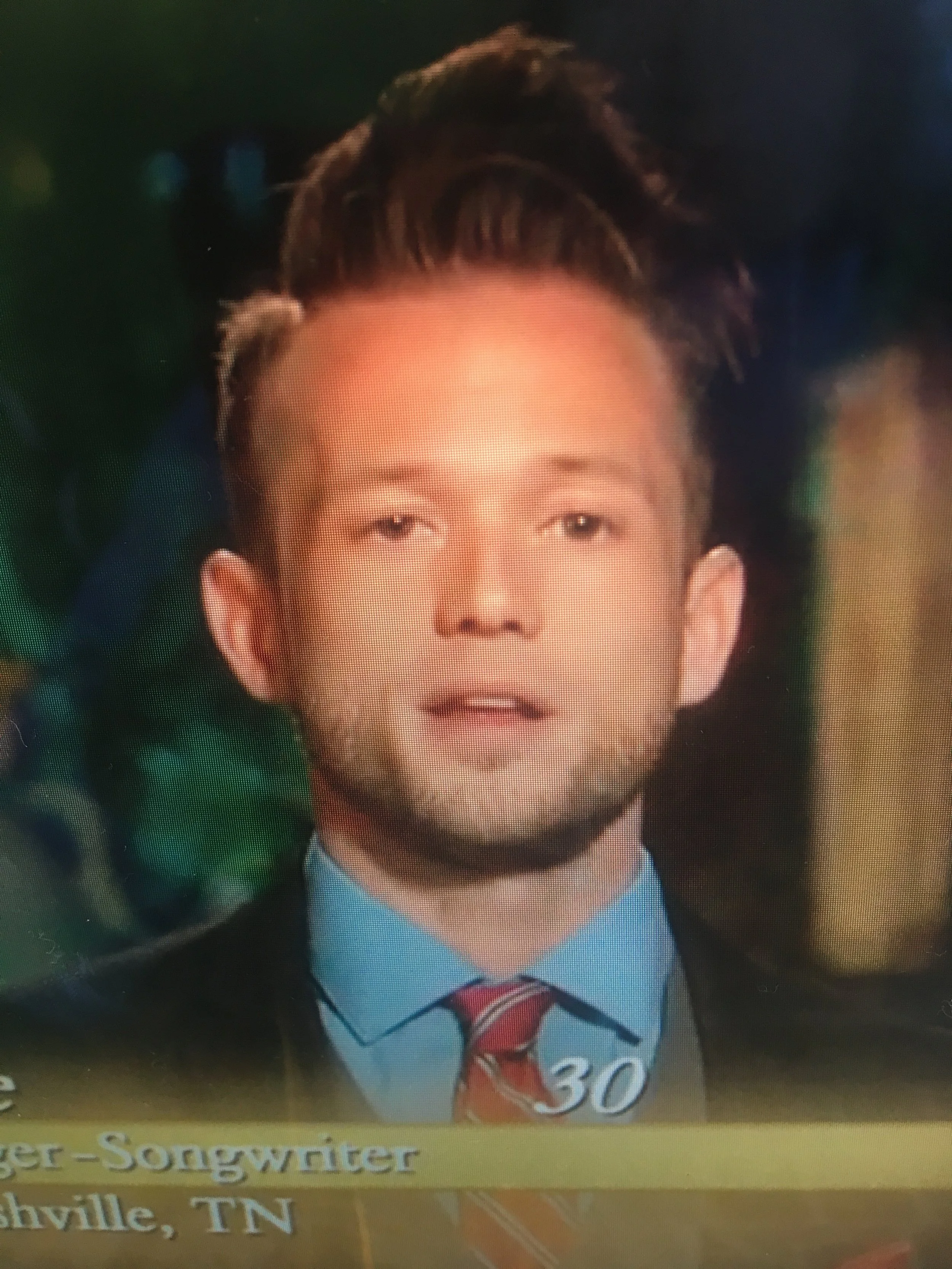 Portrait of a young racist with dumb hair