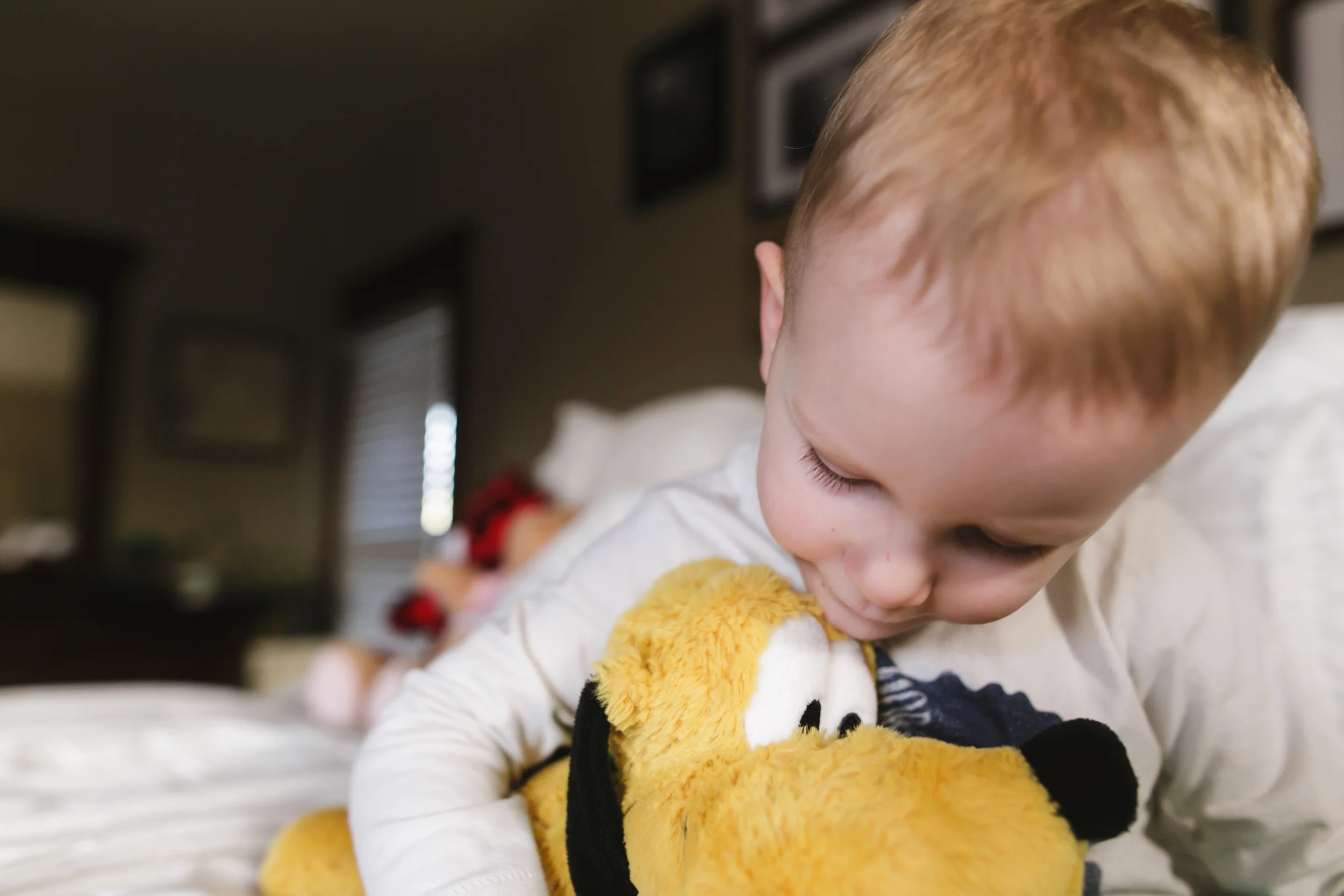 His daily routine during mommy's shower is to snuggle up to this buddy and watch Mickey.