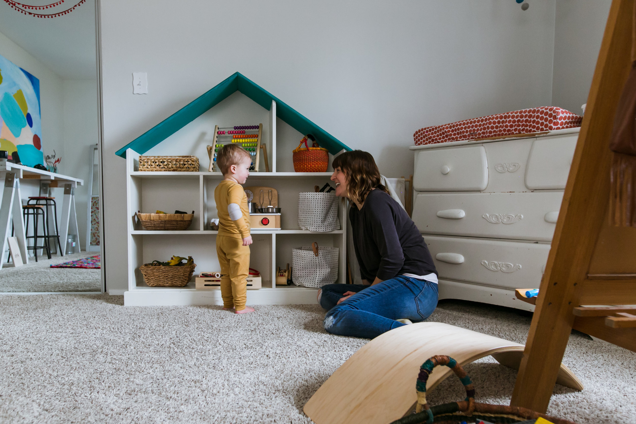 mom and toddler playing in playroom, family film session mishawaka