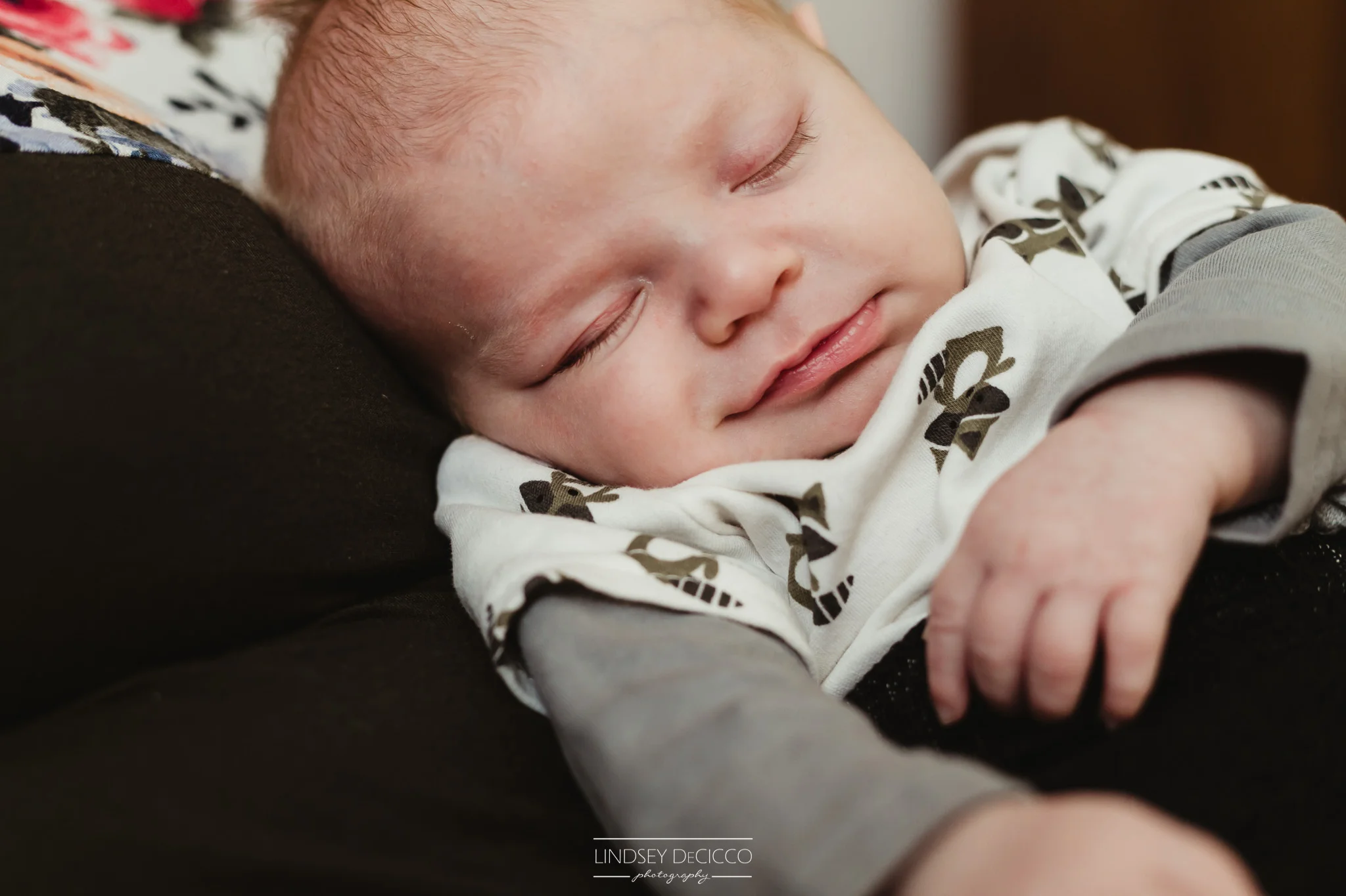 newborn sleepy smiles
