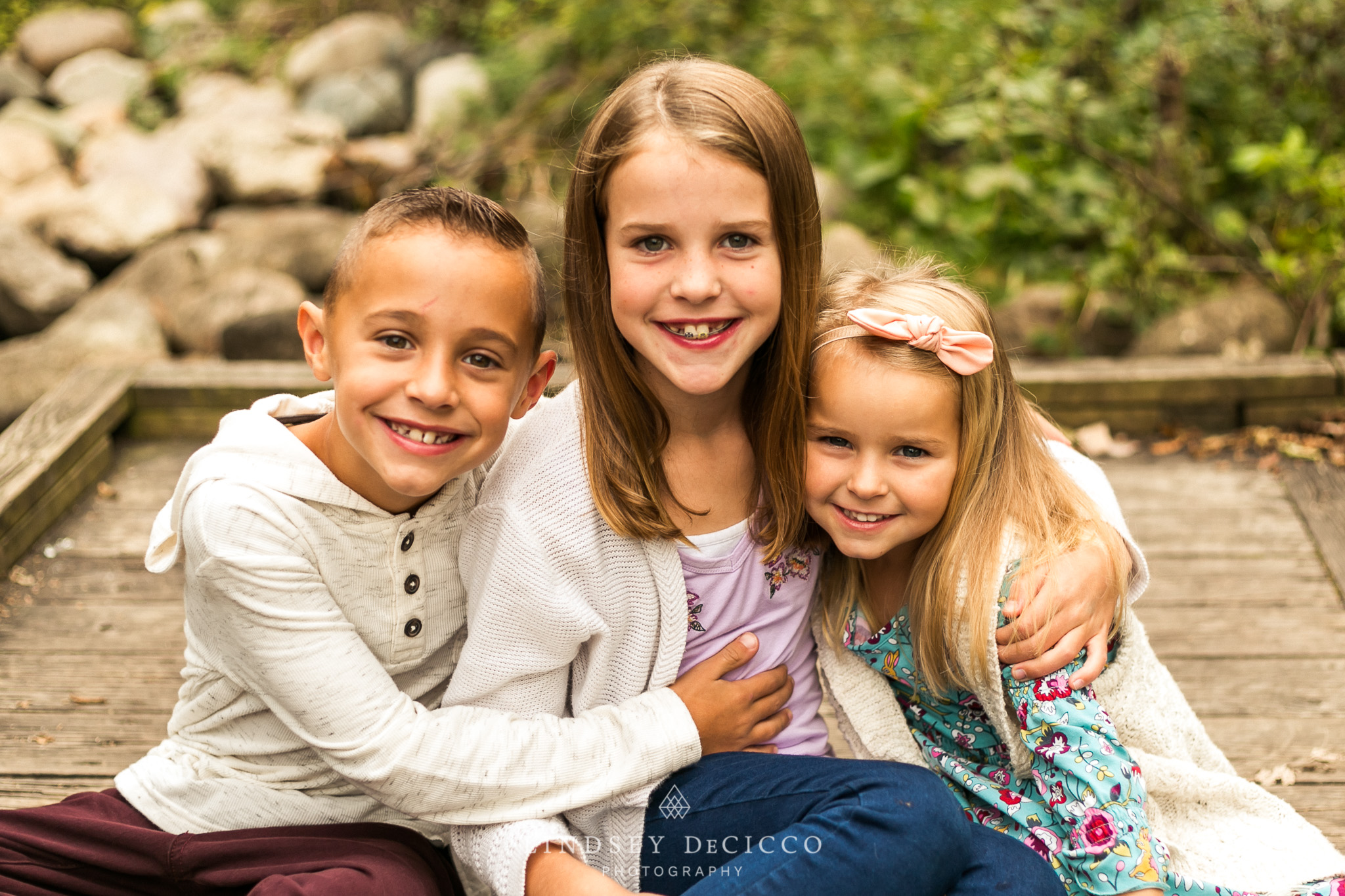 Siblings pose for 3 children