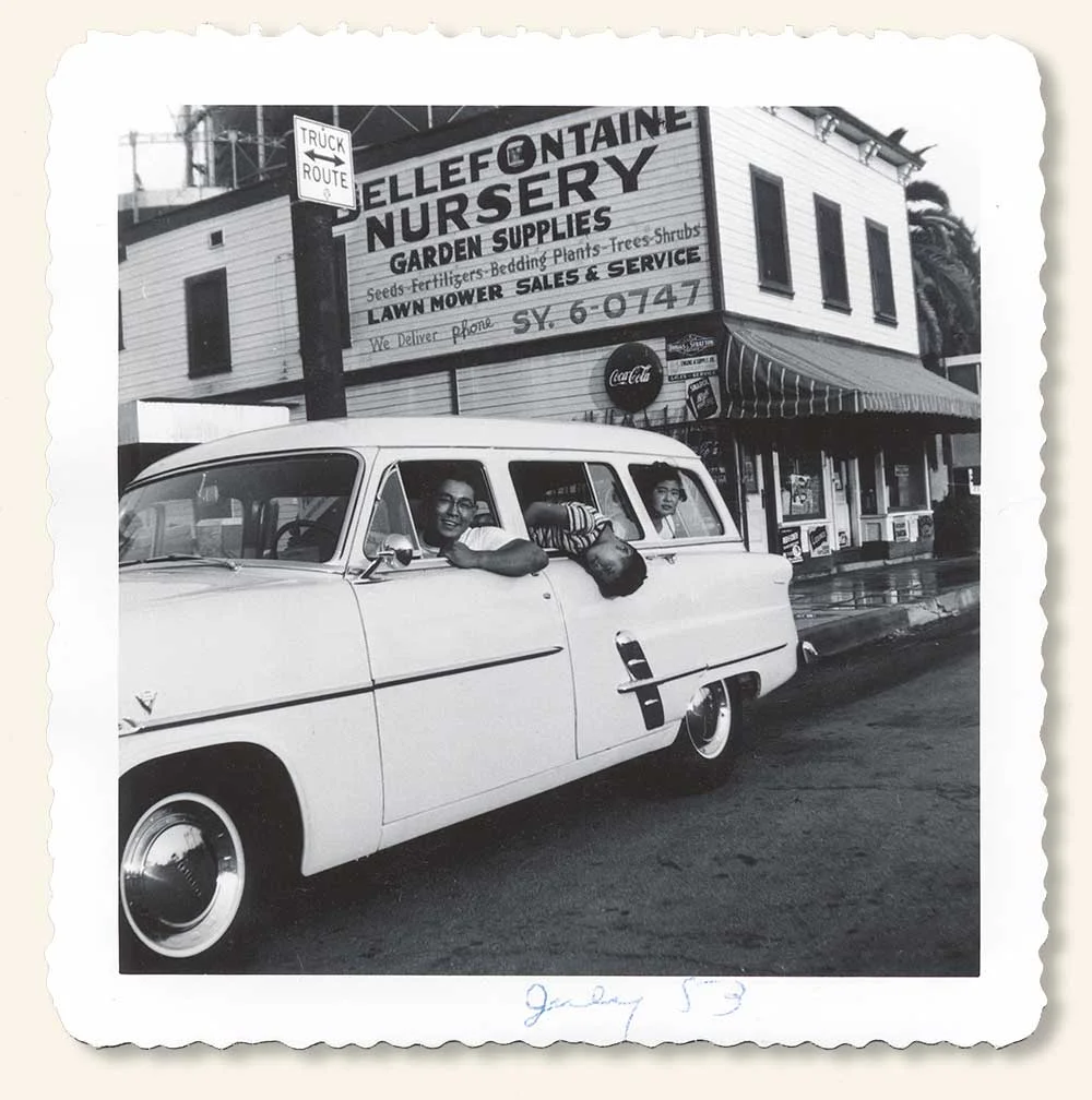 Joyride in '50s Ford Stationwagon. Uncle Bob with cousins David (showing off), and Betty sitting in the back. July 1953. (Click to enlarge.)