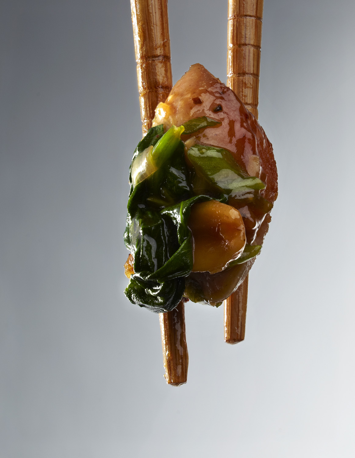 styling chopstick with glazed asian chicken 