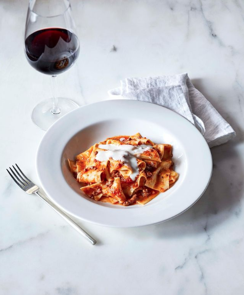  restaurant styling pasta red sauce with wine glass 