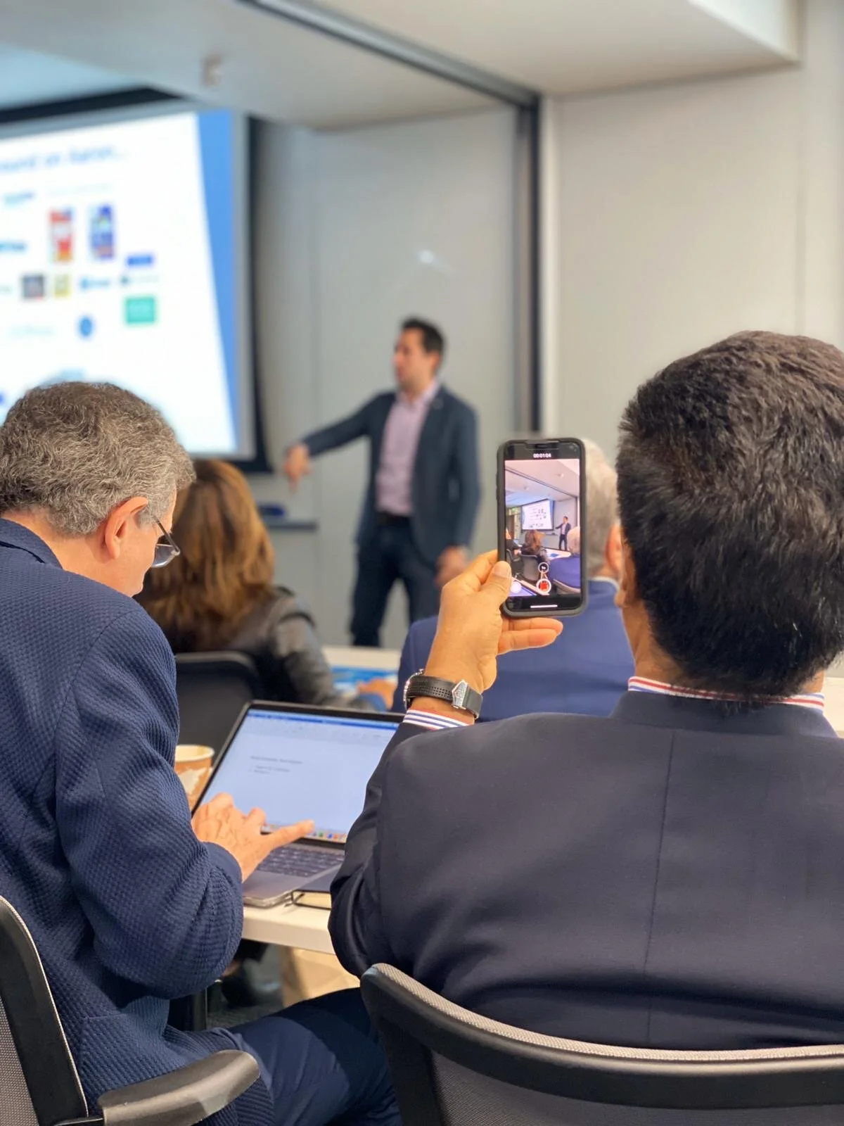 Haas Speaking Through Mobile.JPG