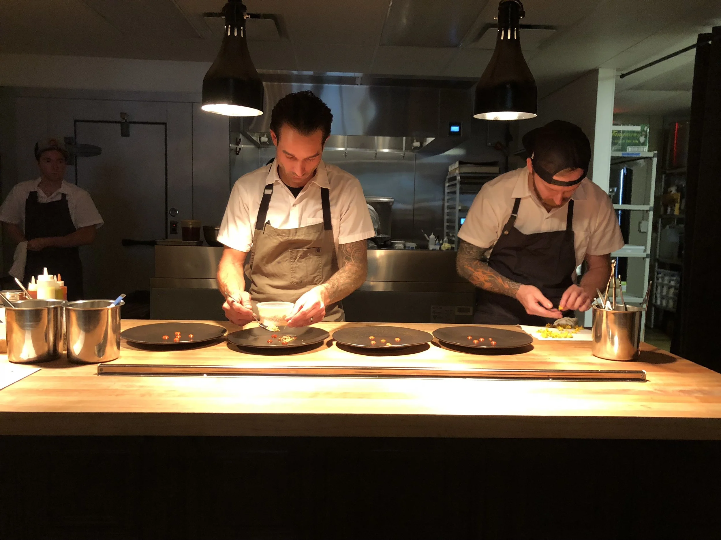 Chef Noll plating the Diver Scallop dish