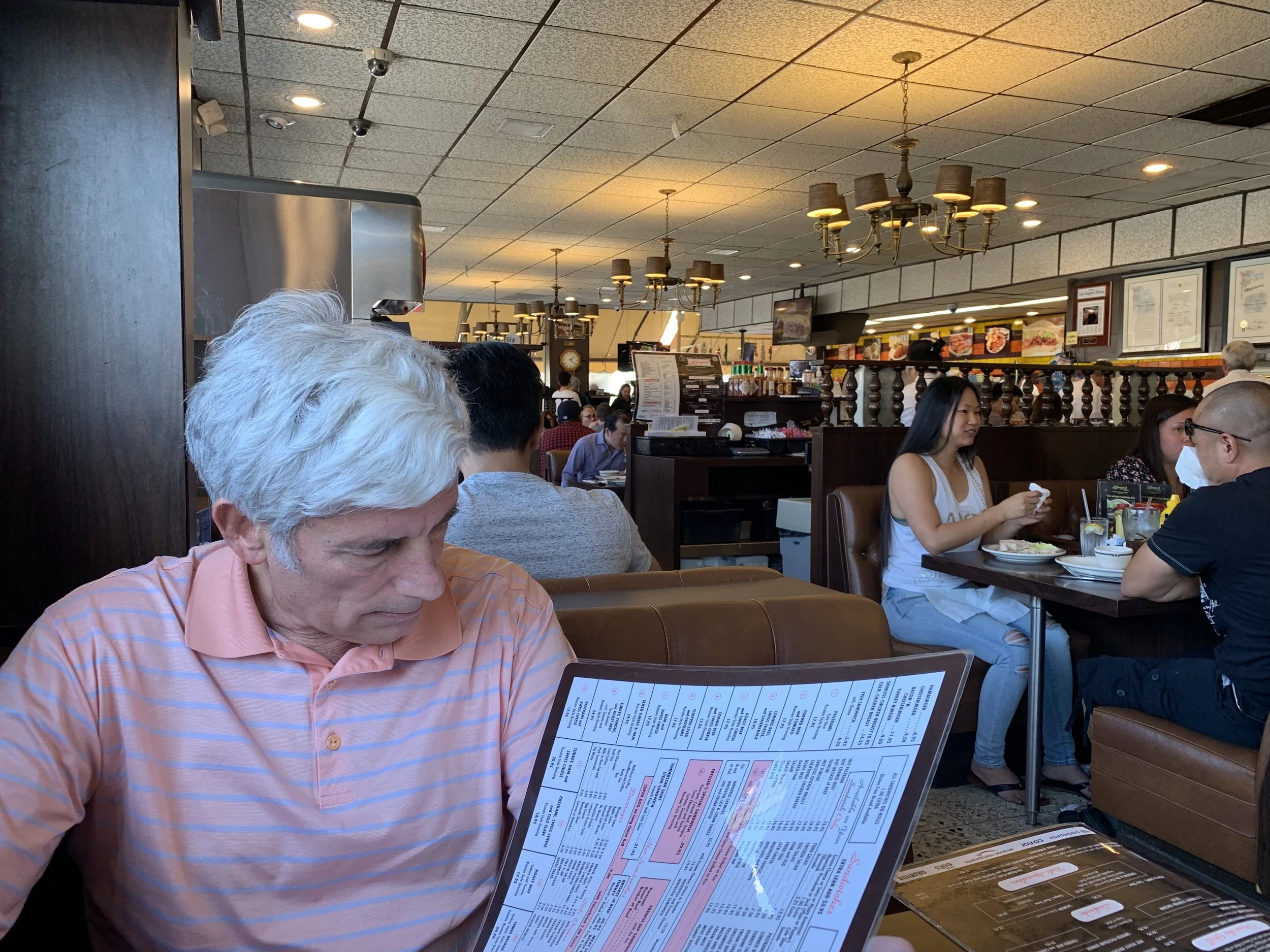 Bernard looking over the gigantic menu (PUT IT DOWN BERNARD!! #19 only!)