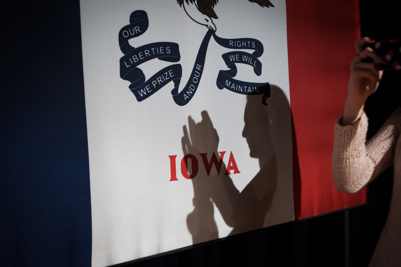  A young woman takes a photo of the stage design after Republican U.S. presidential candidate Ted Cruz's event with Dr. James Dobson, an evangelical Christian author in Winterset Stage in Winterset, Iowa January 4, 2016.  