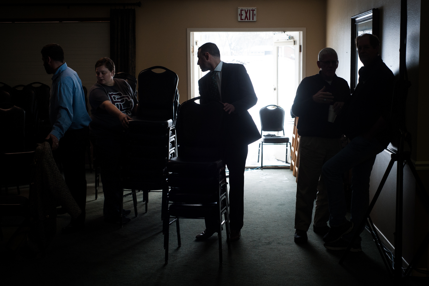  Staff, volunteers, and attendees stack chairs and clean up after Republican U.S. presidential candidate Marco Rubio's town hall event in Pella, Iowa on December 30, 2015. 