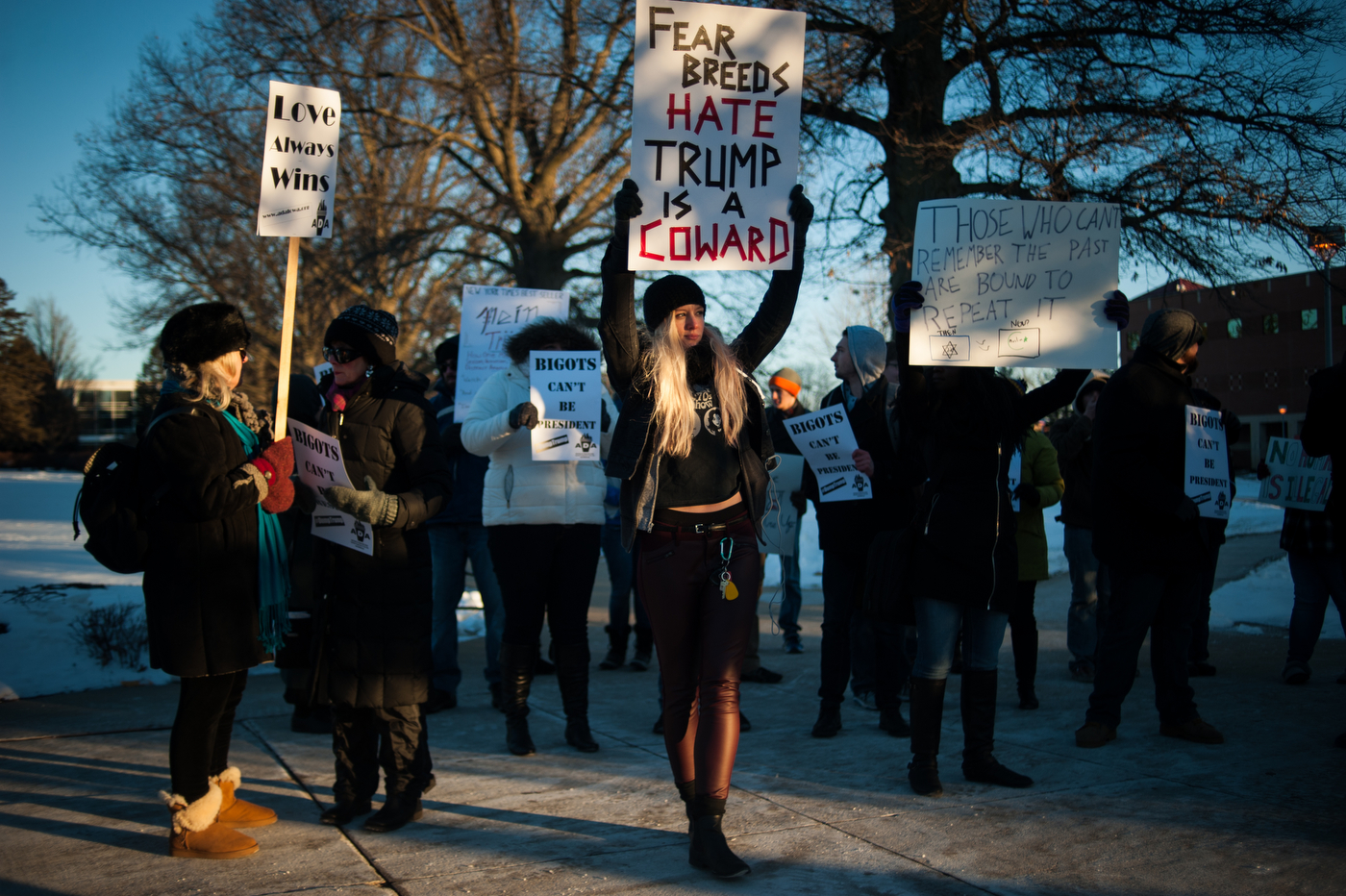  Protestors carry signs and chant before a campaign event for Republican U.S. presidential candidate Donald Trump at University of Northern Iowa in Cedar Falls, Iowa on January 12, 2016.  