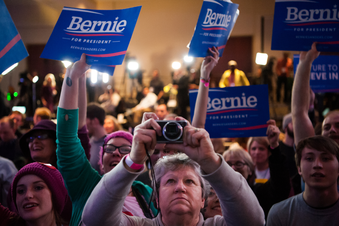  A woman photographs the podium before Democratic U.S. presidential candidate Bernie Sanders' speech a rally on caucus night in Des Moines, Iowa February 1, 2016.  