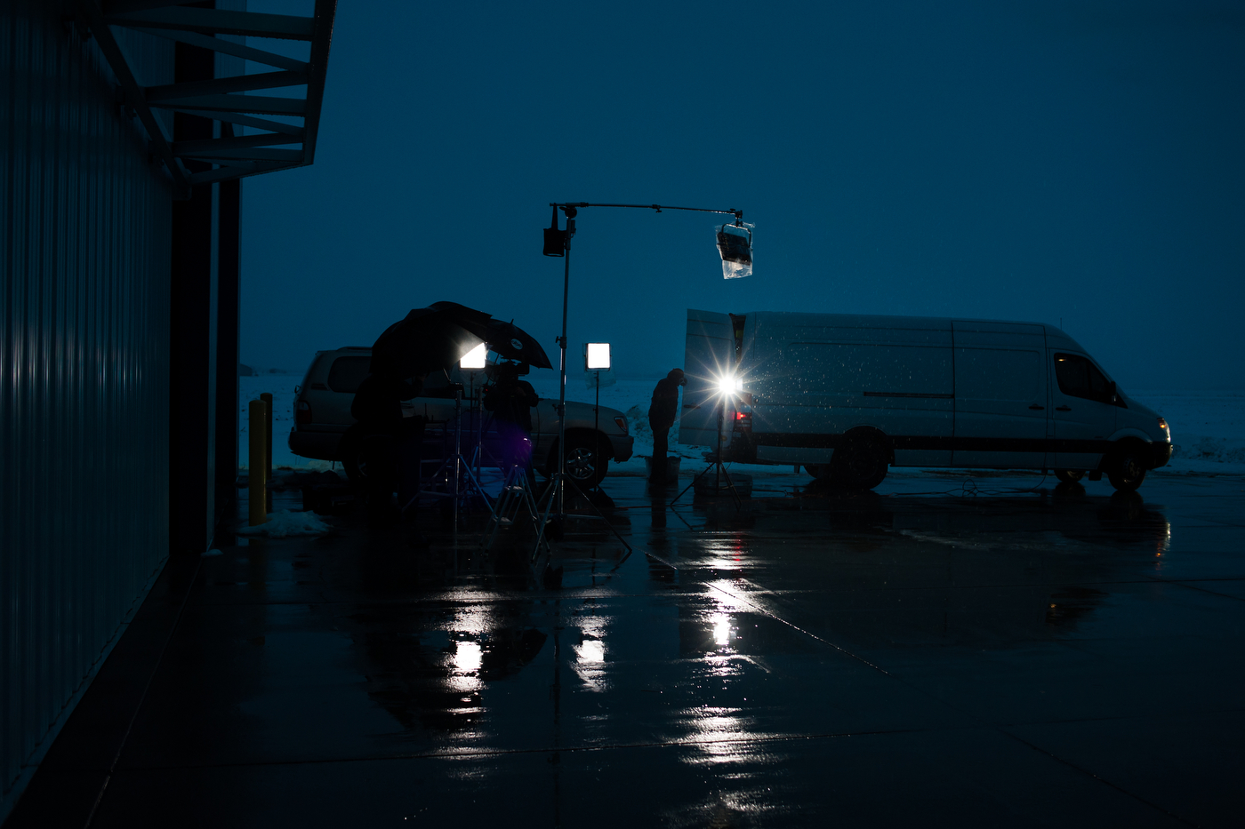  An ABC News crew sets up for a live broadcast in the rain Republican U.S. presidential candidate Ted Cruz speaks inside a hangar at the Webster City Municipal Airport in Webster City, Iowa on January 7, 2016. 