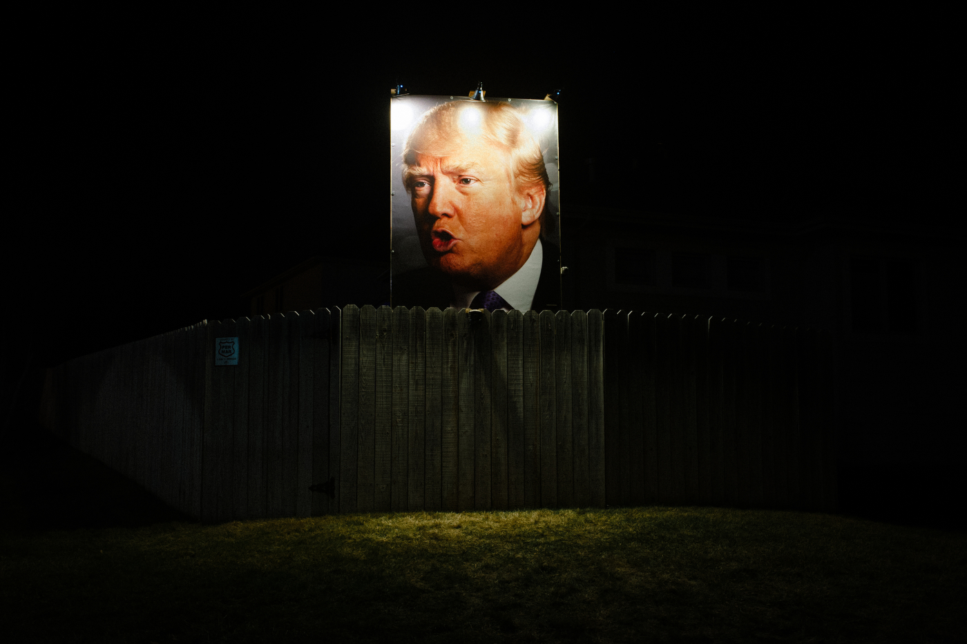  A photo of Republican U.S. presidential candidate Donald Trump stands over the fence at the home of George Davey, a formerly registered independent turned Republican Trump supporter. Davey puts up signage every election at his home off Jordan Creek 