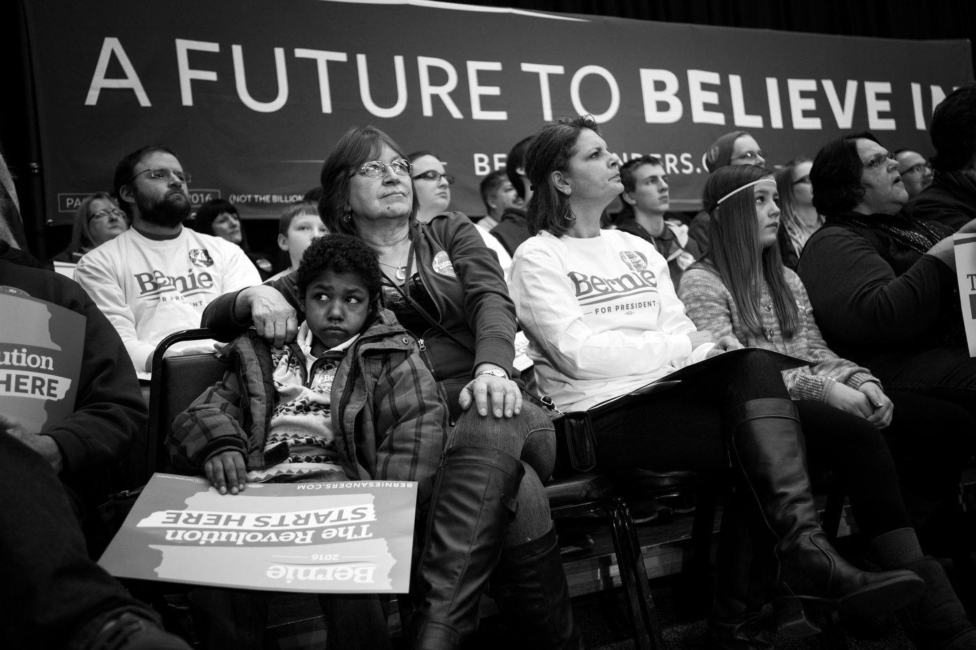  Lonnie McAllister and her grandson Vincent McAllister, 9, listen as Democratic presidential candidate Bernie Sanders speaks at a town hall in Independence, Iowa on January 24. 