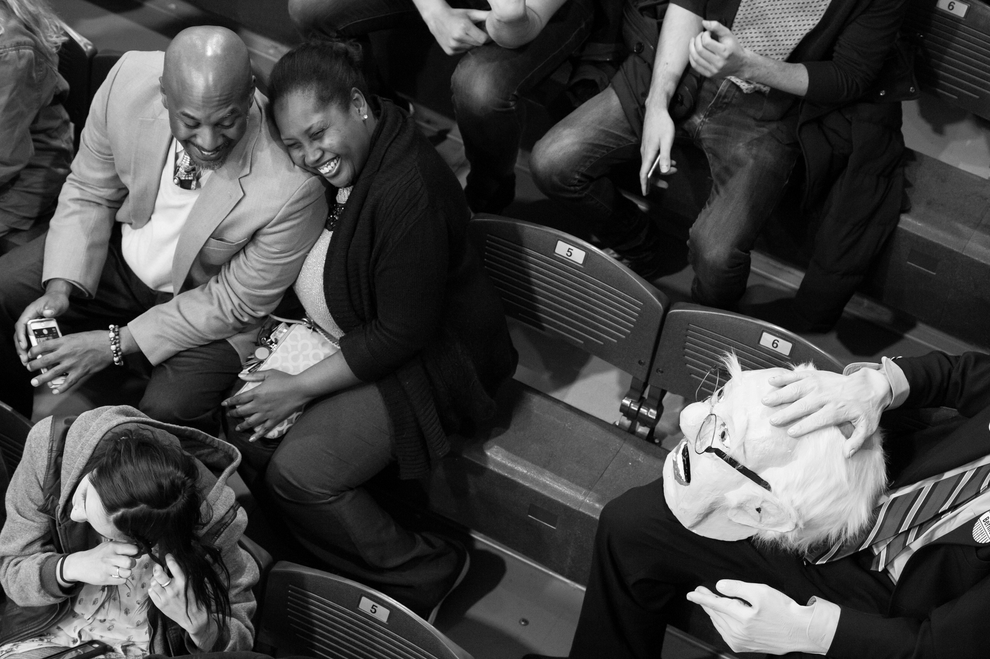  A couple laughs as a man holds a mascot head in the likeness of Democratic presidential candidate Bernie Sanders while waiting in the overflow area before a rally at Temple University in Philadelphia, Pennsylvania on April 6. 