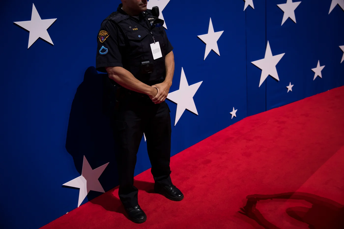 A Cleveland Police Officer stands guard while being photographed by a delegate at the Republican National Convention in Cleveland, OH.