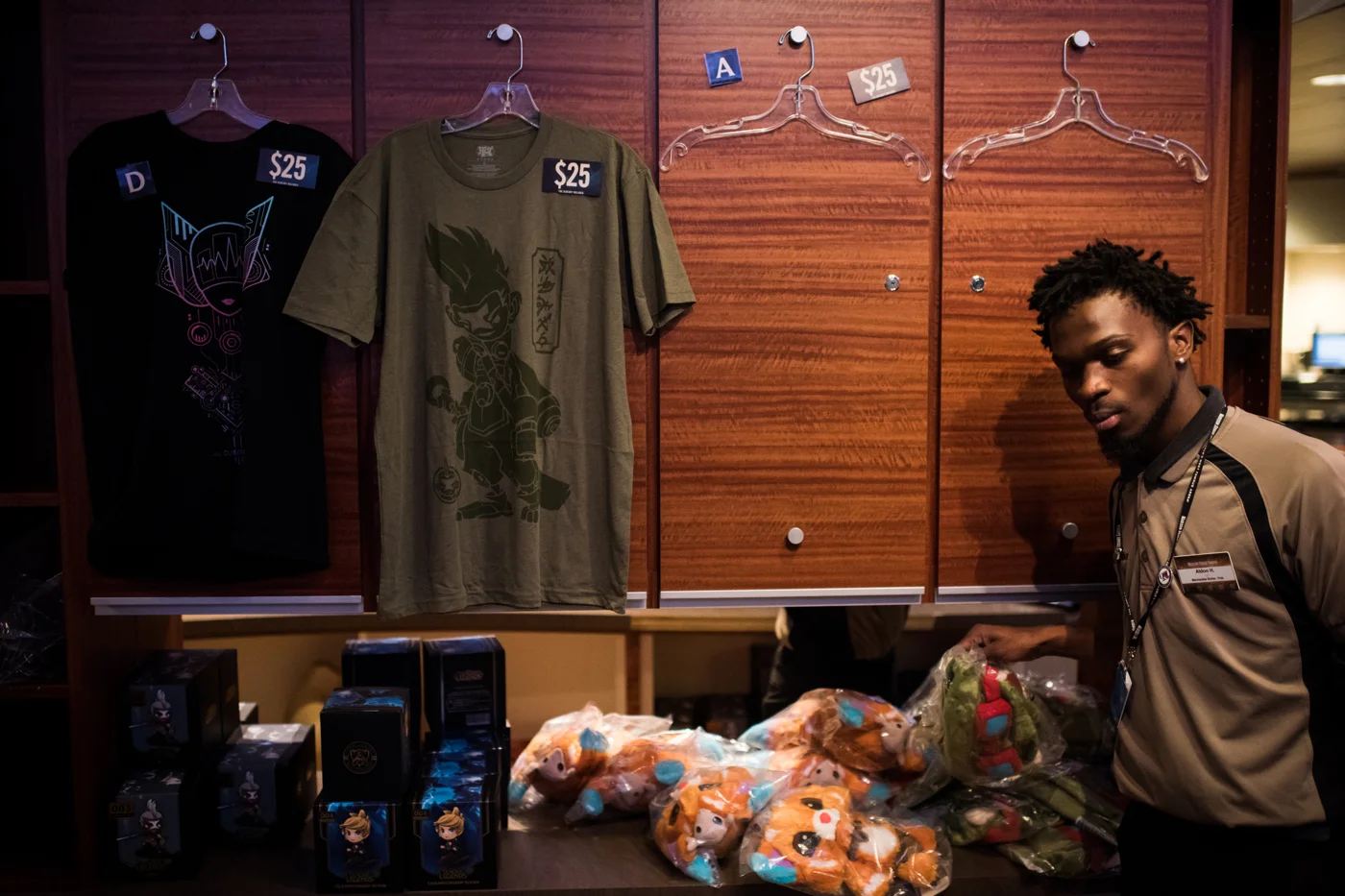 League of Legends merchandise sits for sale at Madison Square Garden, while some shirt hangers are empty due to much of the merchandise being sold out by the second day.