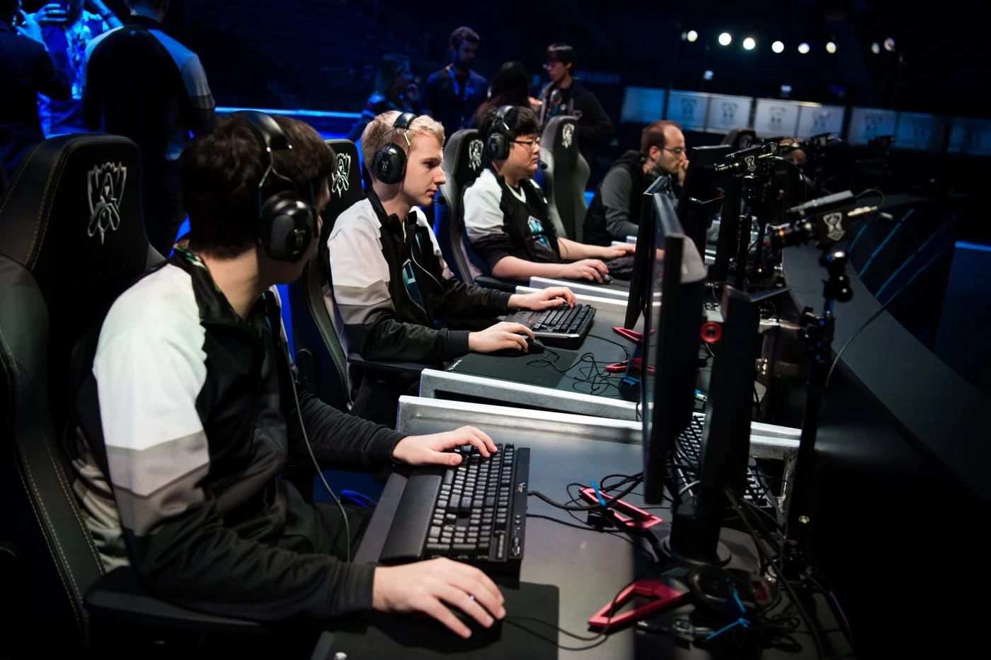 H2k checks their computer settings and headphone levels during a rehearsal on state at Madison Square Garden. Players wear noise-canceling headphones with white noise pumped in to cancel out most of the crowd reaction while still being able to communicate.