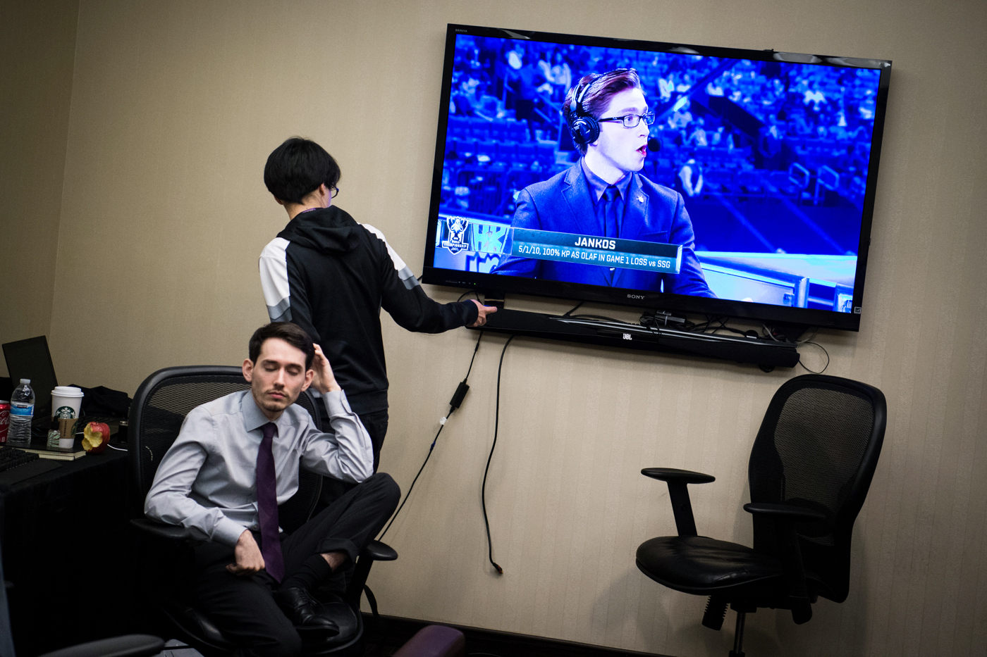  H2k-Gaming team analyst Michael "Veteran"&nbsp;Archer tries to turn off the television recapping the team's loss as head coach Neil "PR0LLY"&nbsp;Hammad tries to gather his thoughts. 