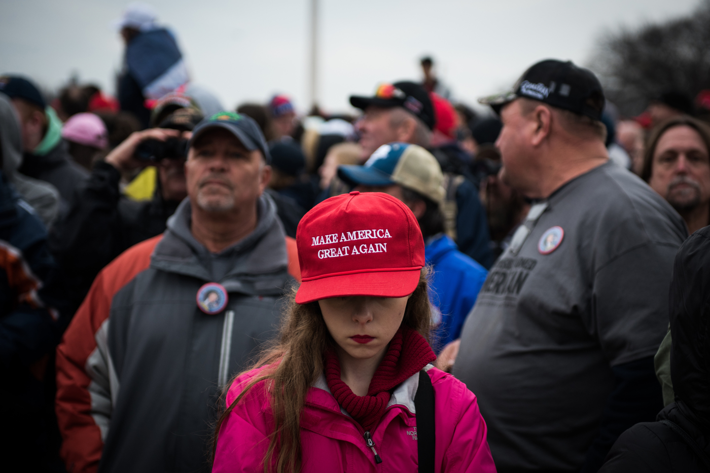 A young woman waits for the start of the ceremonies for President Donald Trump's inauguration as the 45th President of the United States in Washington, D.C., on January 20, 2017. Credit: Mark Kauzlarich for CNN