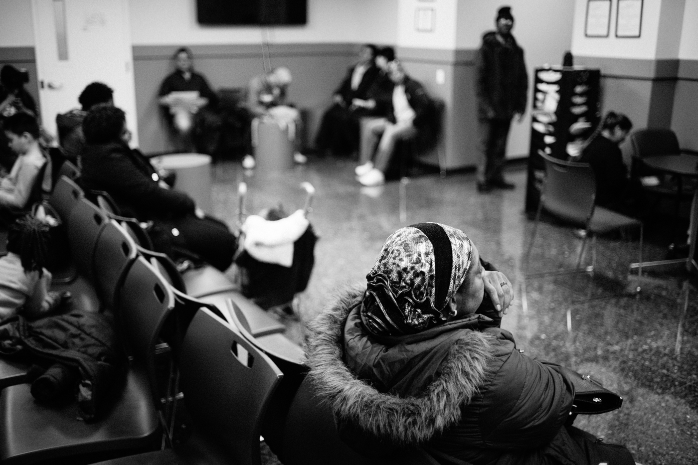 People sit in the waiting room at Catholic Charities Community Services during their walk-in hours for immigration-related legal services in New York, NY on March 9, 2017. CREDIT: Mark Kauzlarich for CNN