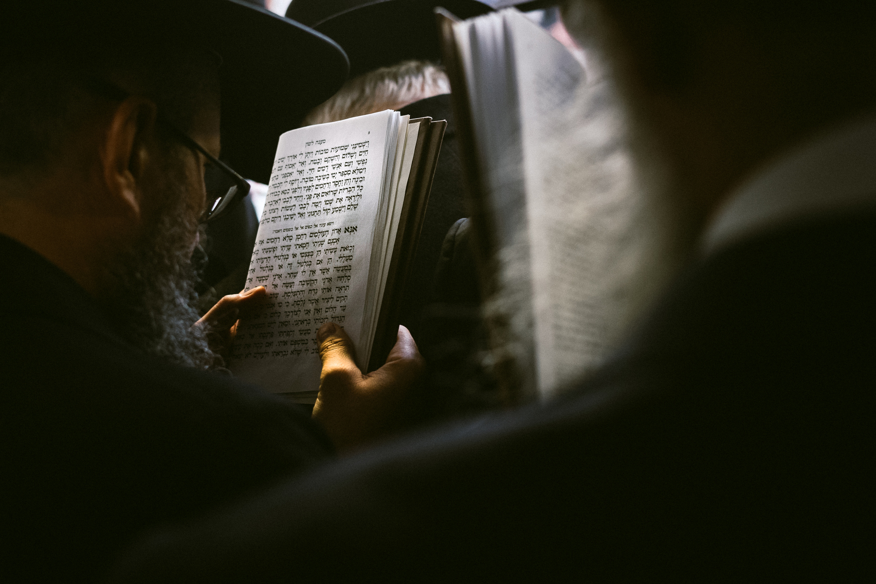  Chabad-Lubavitch rabbis read from their prayer books at the gravesite of the Lubavitcher Rebbe, Rabbi Menachem M. Schneerson, in the Queens borough of New York, NY. 