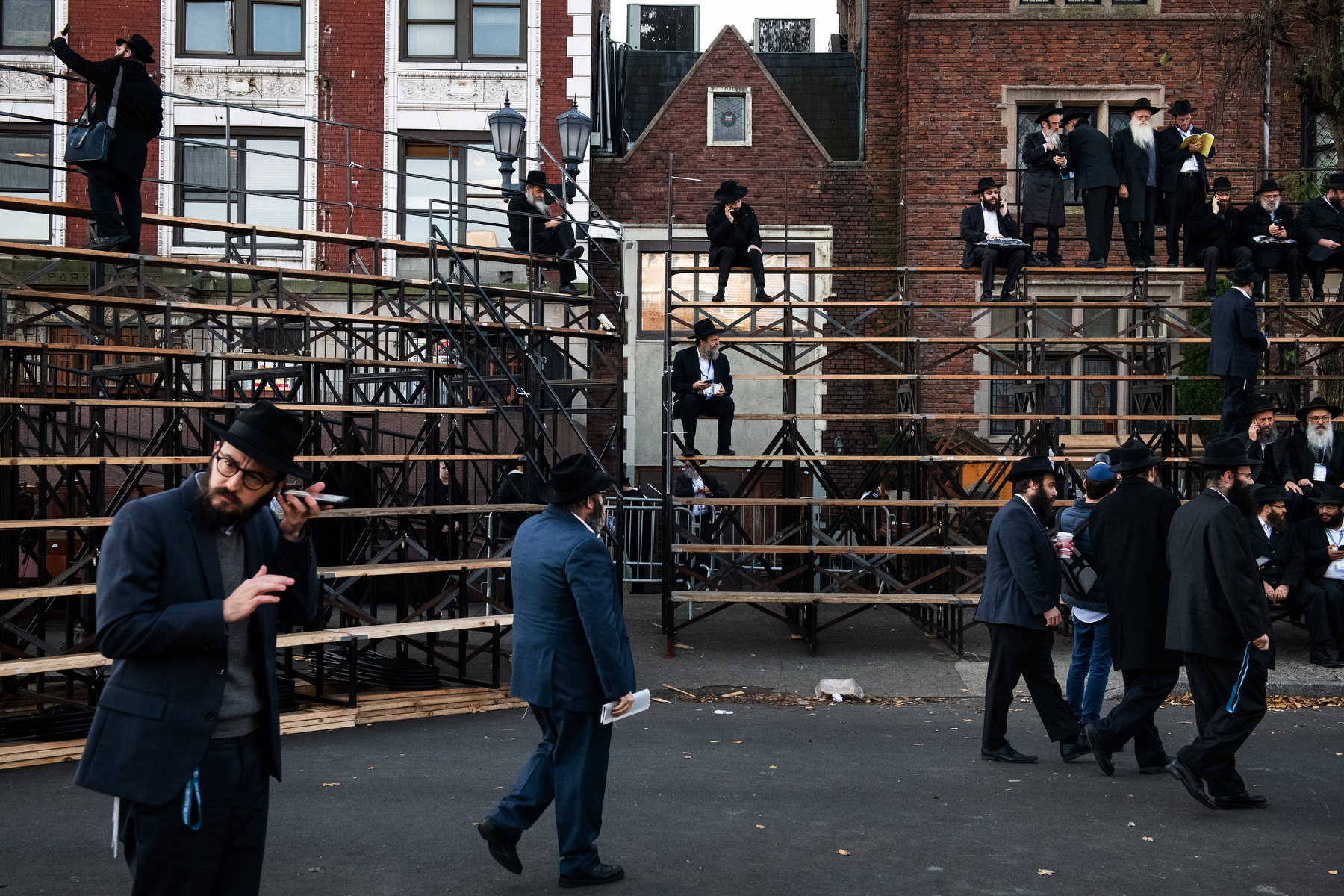  Chabad-Lubavitch rabbis arrive as thousands gather for a group photo in front of the movement's headquarters in the Crown Heights neighborhood of Brooklyn, NY. 