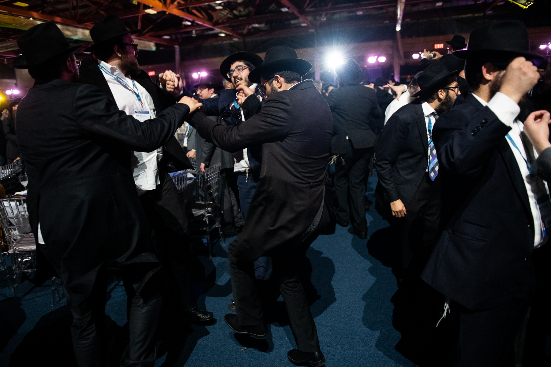  Thousands of Chabad-Lubavitch rabbis and their guests dance after a roll call of all the Chabad emissaries a banquet in Suffern, NY. Each year, the International Conference of Chabad-Lubavitch Shluchim, or emissaries, takes place in the New York Cit