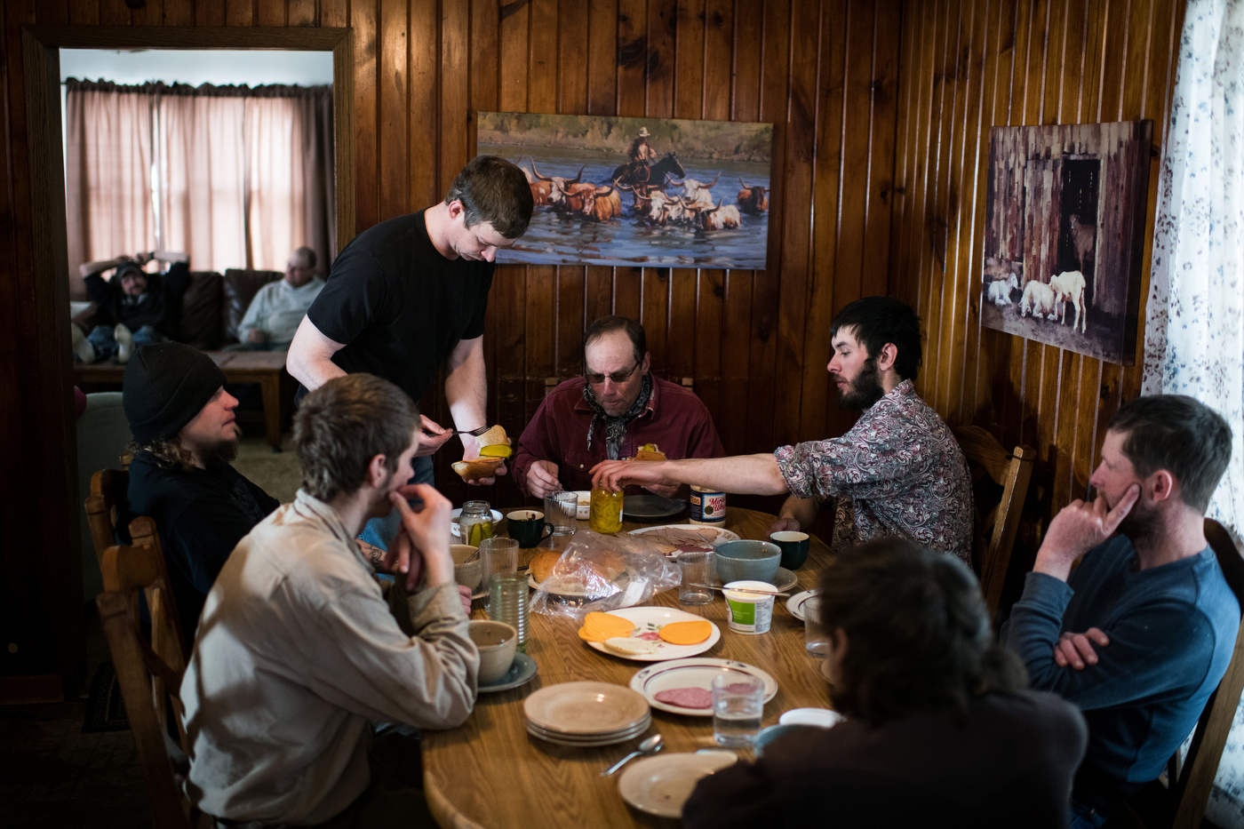  45º29'43.2"N 102º19'59.6"W. 120 miles from the nearest McDonald's. A group of men sit down around the dinner table for a meal of soup and sandwiches as they take a break from shearing sheep in the 20 degree weather and substantial winds at the Kronb