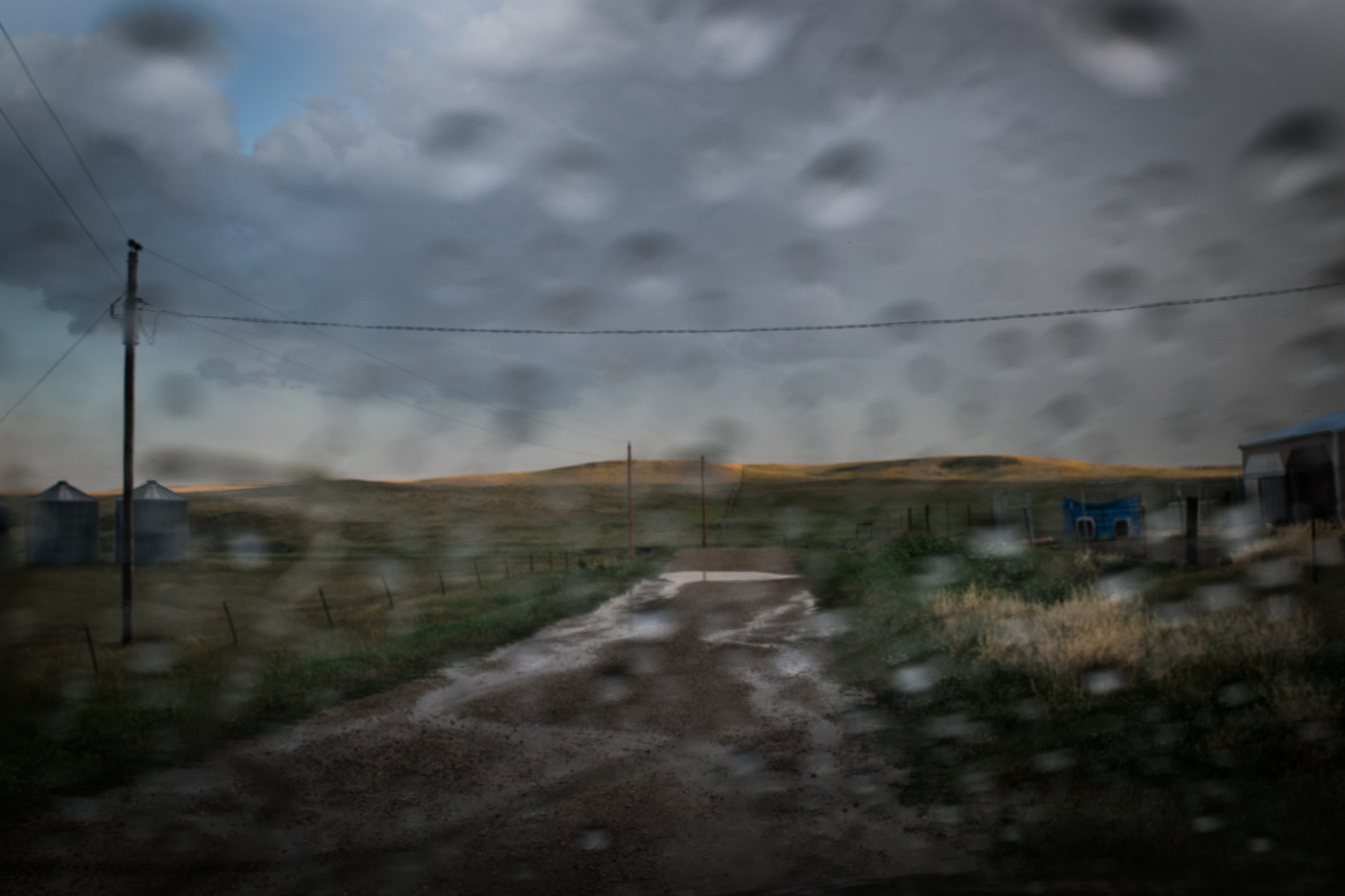  45°32'45.9"N 102°07'41.0"W. 123 miles from the nearest McDonald's.  Rain runs down a dirt road on the Lorius ranch in Meadow, SD on July 28, 2017. An extreme summer drought caused a state of emergency in both North and South Dakota which meant that 