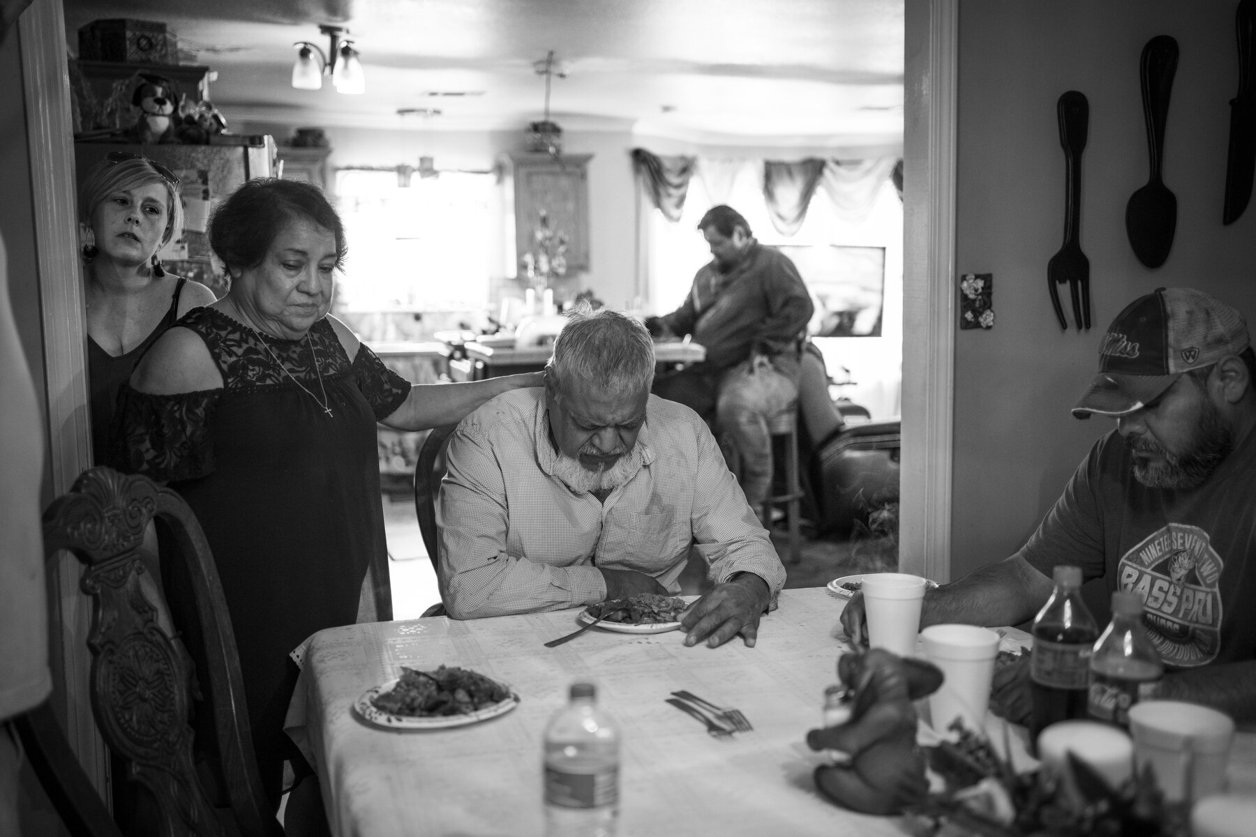  Lydia Rios prays over her husband Noe Rios alongside their children and family at their home in Dublin, MS. Noe Rios has cancer in three places in his body and already suffers from debilitating back pain from a broken and repaired back, but the fami