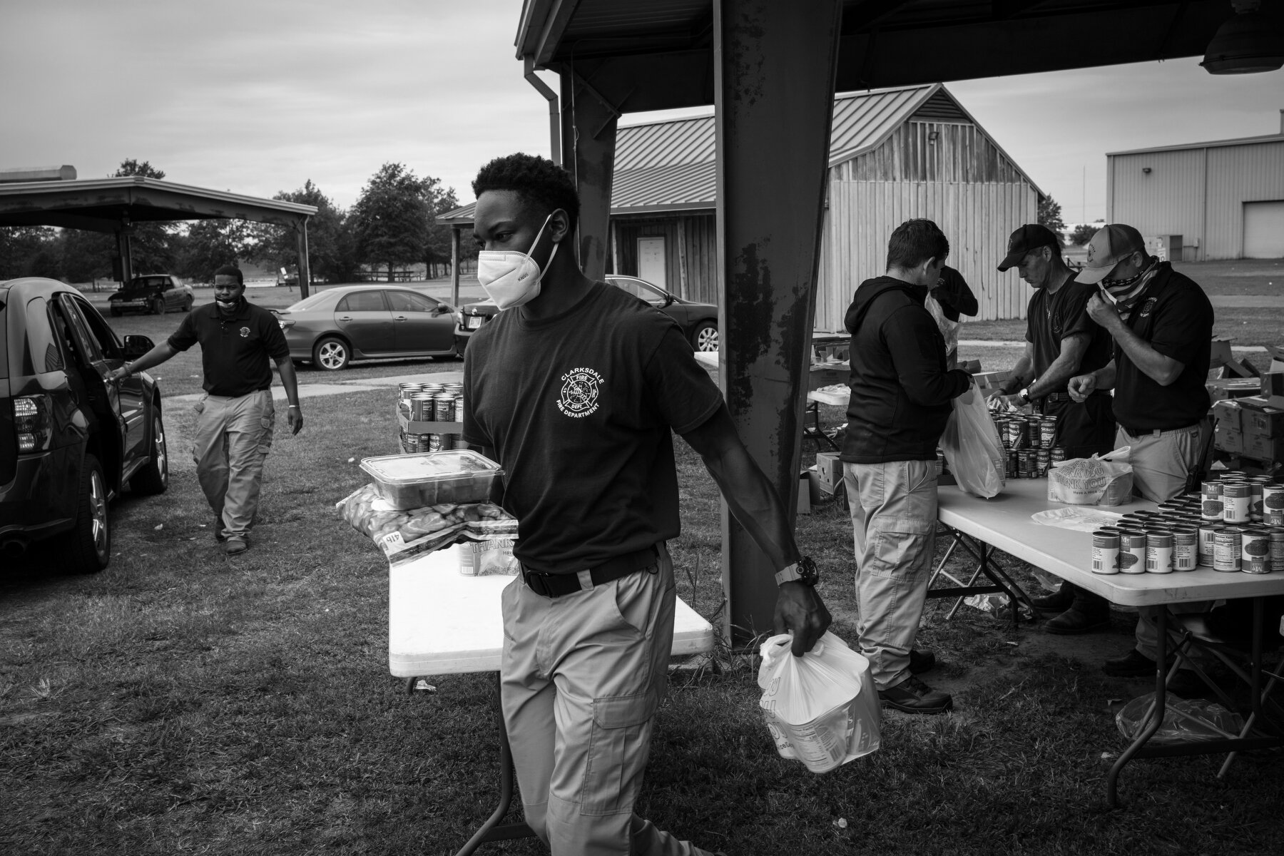  Volunteers, including members of the Clarksdale Fire Department, distribute approximately 20,000 pounds of food to somewhere between 500 and 600 families as a part of a monthly food distribution program run by a nonprofit called Care Station in Clar