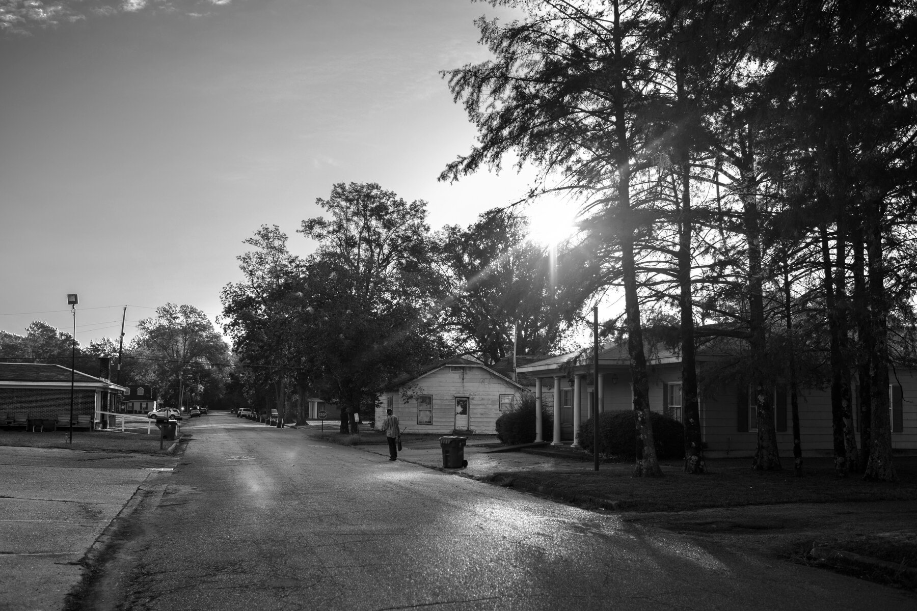  A man walks down the street in the city of Marks, MS. 