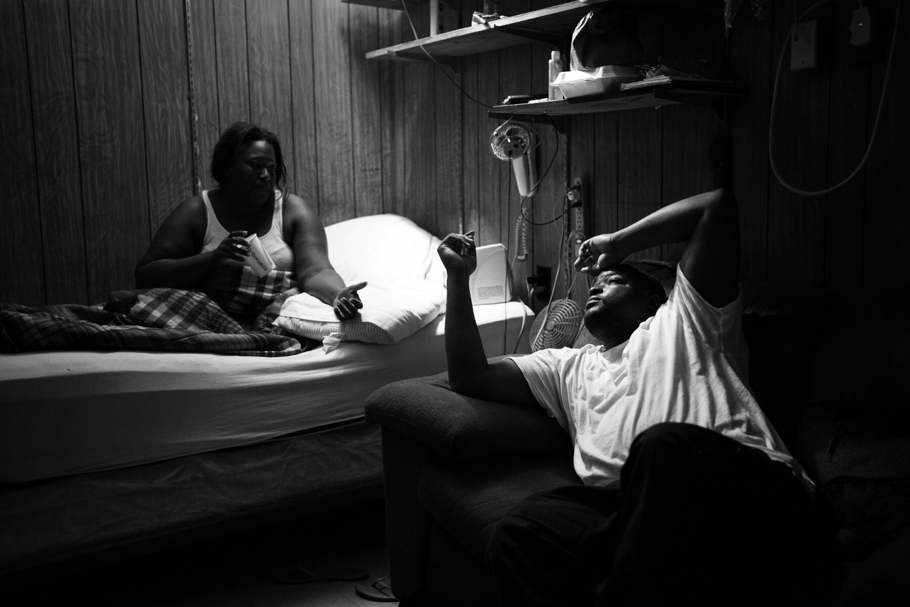  Jaleesa Coleman and David Glasper chat in the back break room at the Quitman County Ambulance Service in Marks, MS. The ambulance service did not have an actual ambulance until 1976, using hearses for years with no formal medical training, but even 
