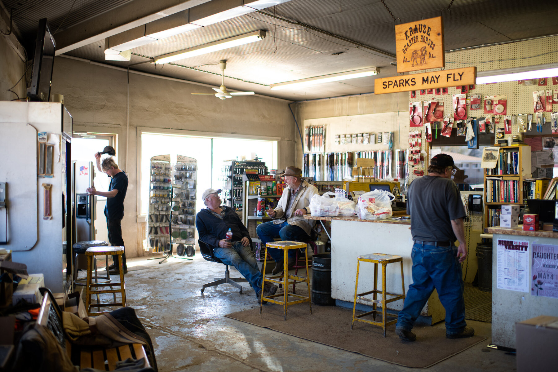  Coffee hour at the Bison Implement, a shop for mechanical supplies and repairs, run by second and third generation owners Allen Palmer and his son Conner in Bison, SD. 