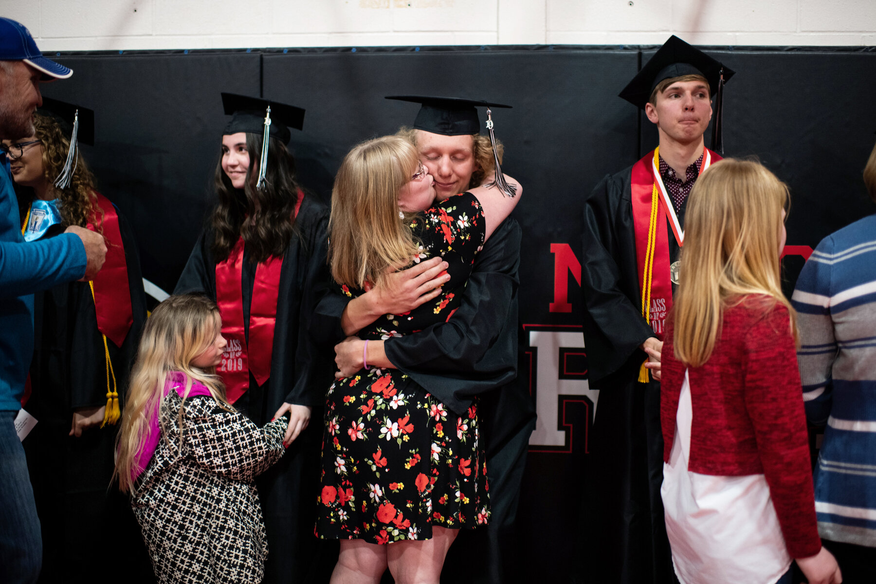  Graduates wait in a reception line as a large number of community members greet them after the Bison High School graduation ceremony in Bison, SD. Out of nine students graduating, two students are foreign students, including one who will have to ret