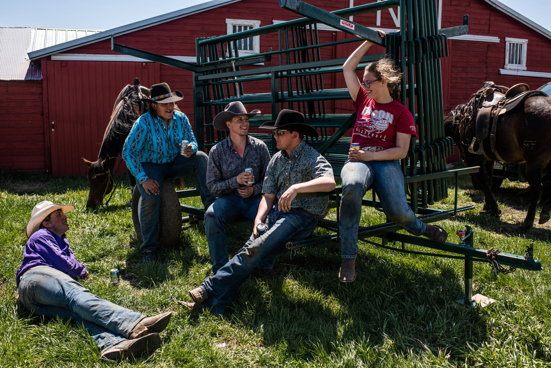  People relax, drink, and eat dinner after a branding on land leased by Cam and Norman Miles in Glad Valley, SD. 