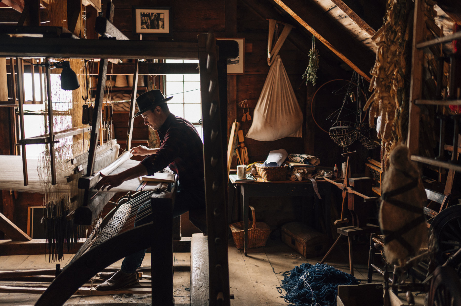  Justin Squizzero working on likely the only operating hand-run Jacquard head loom in North America, with parts dating to c. 1650-1750. 