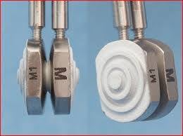 This is the complete Adamo Spinal Disc implant. The white material on the back of the implants promotes bony fusion between the vertebrae and the implant.