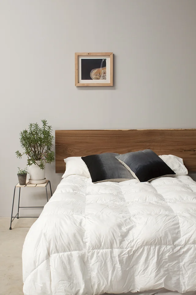 A gorgeous one off bed head made from a slab of timber sourced at the local sawmill. Photo: Mast Furniture