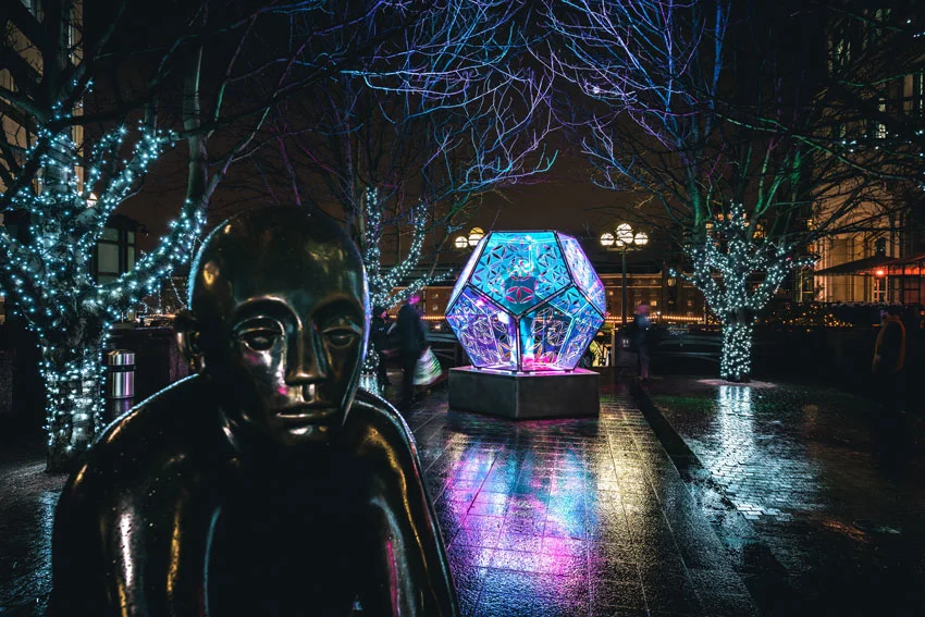 Dazzling Dodecahedron lite at night at Canary Wharf