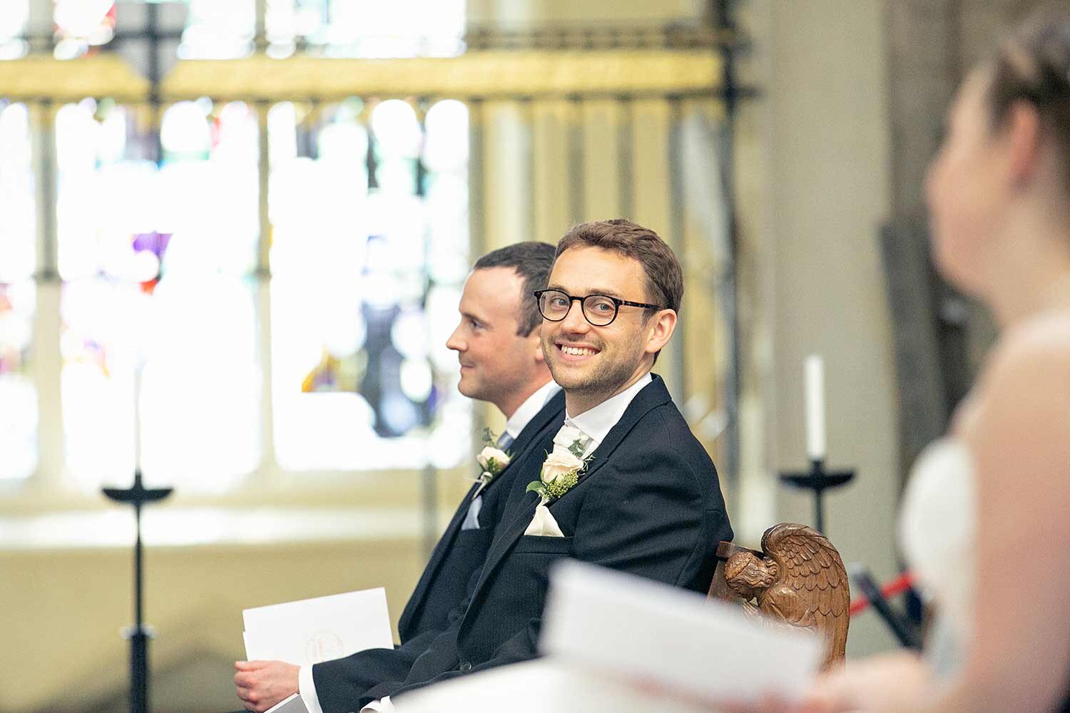 groom-looking-at-bride-norwich-cathedral.jpg