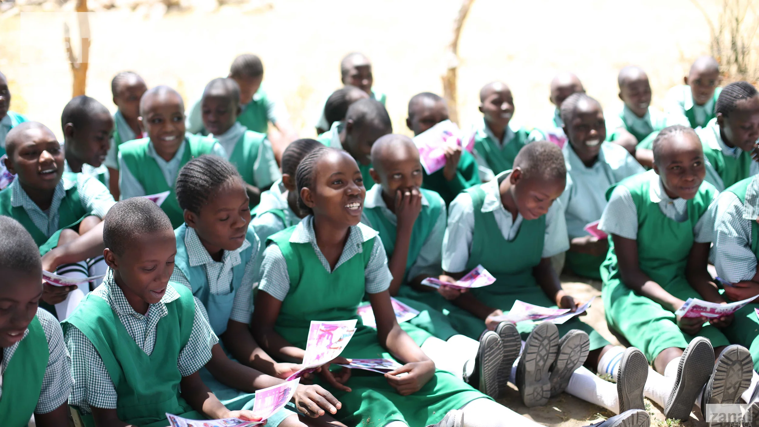 ZanaAfrica Foundation - Girls in Machakos Reading Nia Comics.jpg